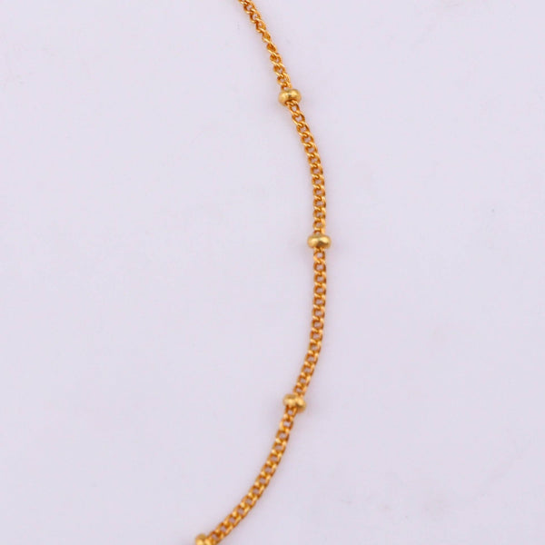 Gold chain bracelet with certification label