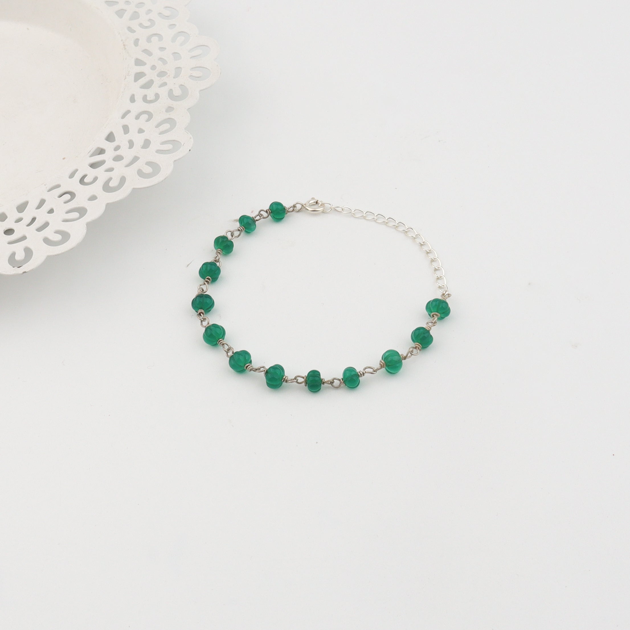 Detail shot of ganthan pattern and green onyx setting