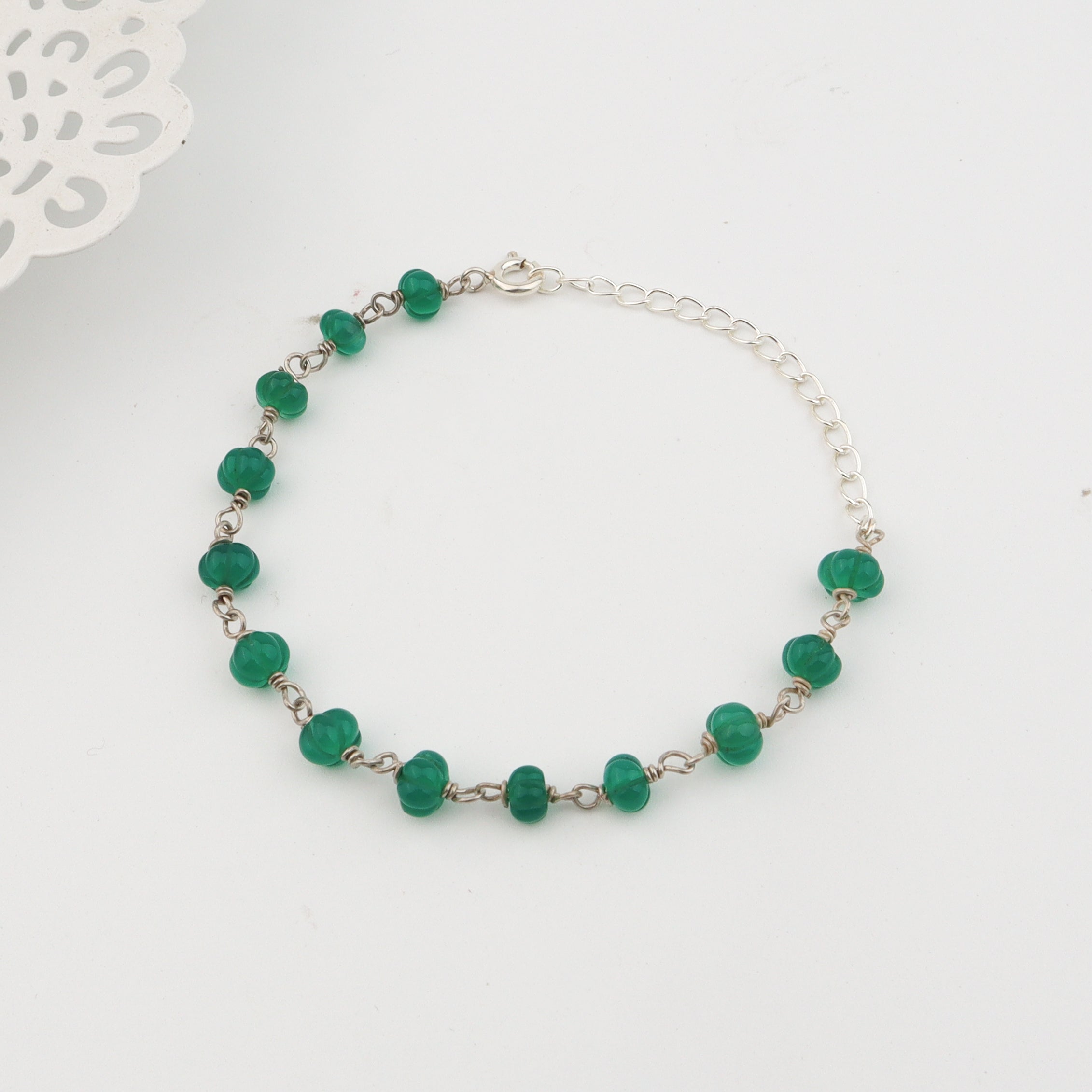 Angled side view of Silver Green Onyx Ganthan Bracelet