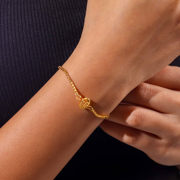 Model wearing a 22K gold-plated fashion bracelet for a sophisticated and contemporary jewellery look