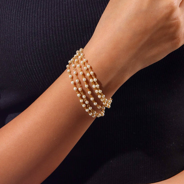 Model wearing 22K gold-plated fashion bracelet for a sophisticated and contemporary jewelry look