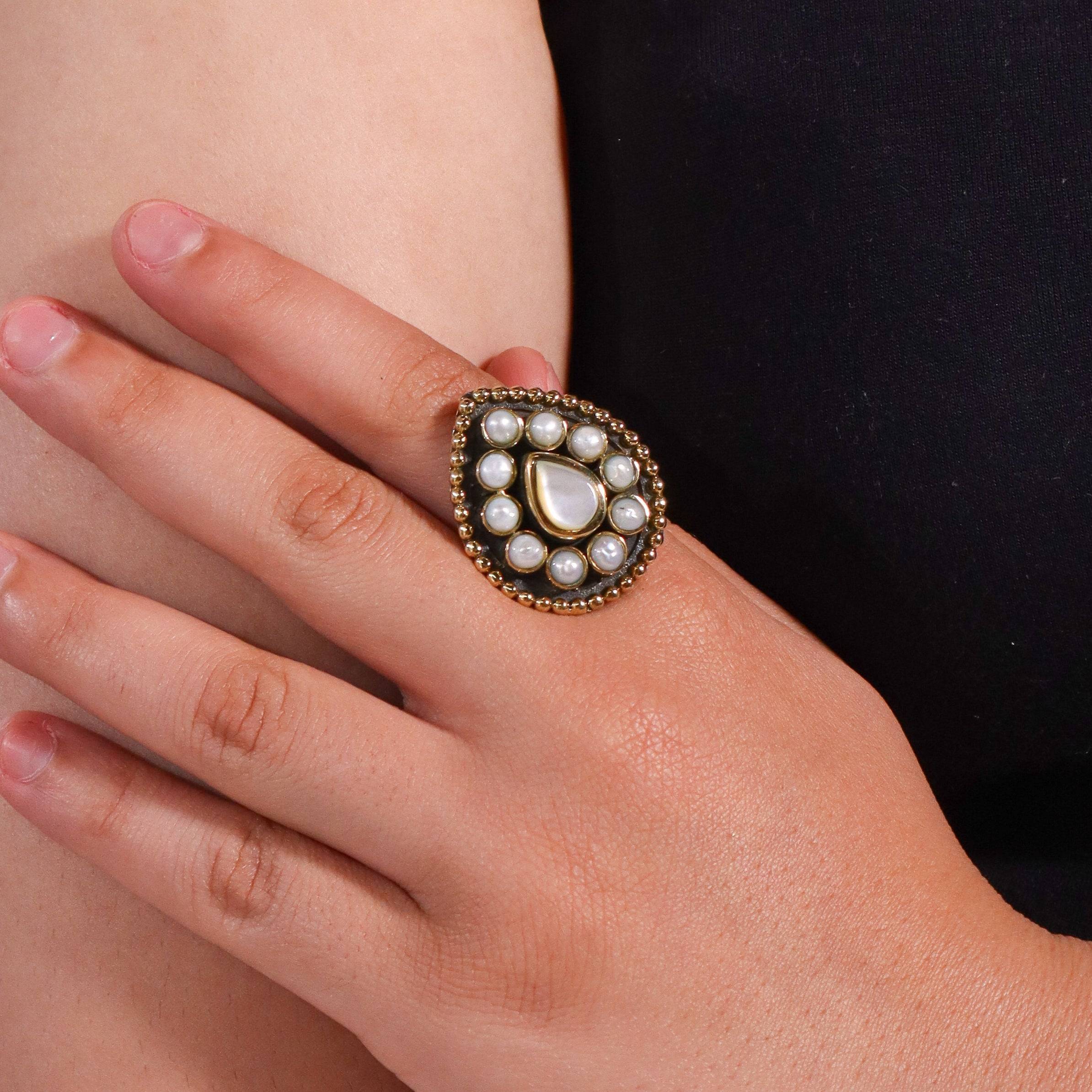 Model wearing a brass fashion ring for a stylish and contemporary fashion jewellery look
