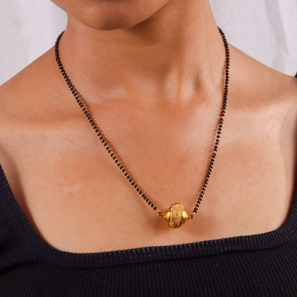 Model wearing a 22K gold-plated fashion mangalsutra for an elegant and sophisticated traditional jewelry look