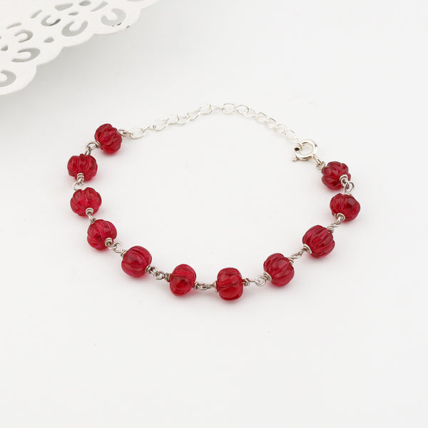 Angled side view of Silver Ruby Ganthan Bracelet
