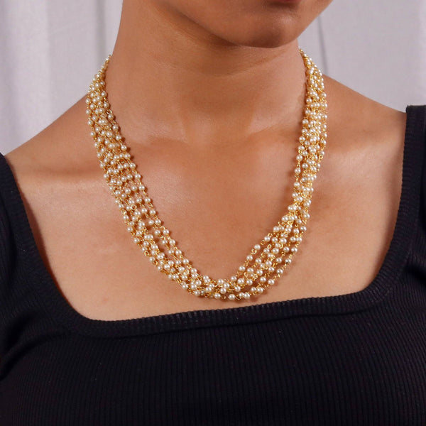 Model wearing a 22K gold-plated fashion necklace for a sophisticated and elegant jewelry look