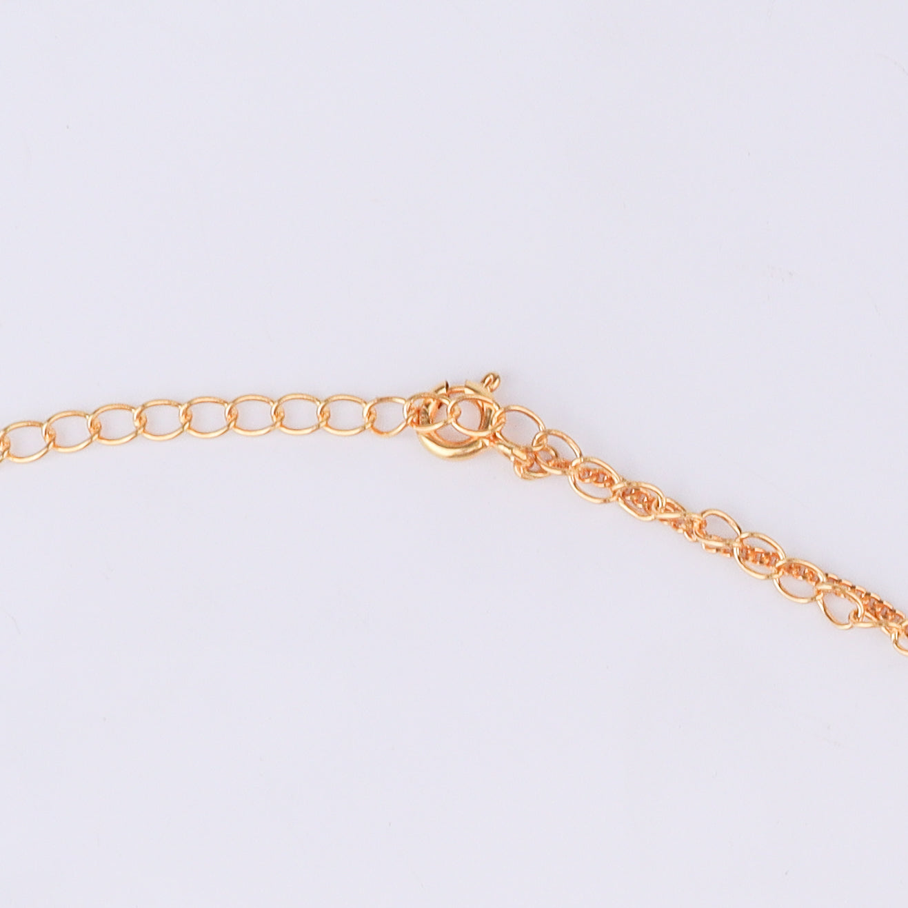 Gold chain with pearl details for waist jewelry on white background