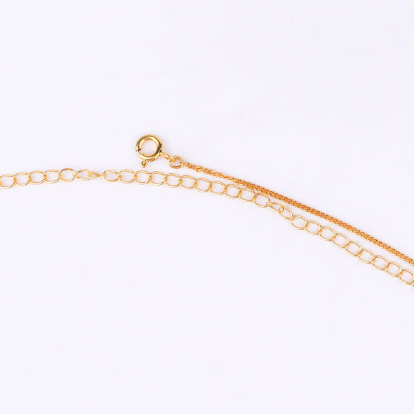 Gold chain with black beads and clasp