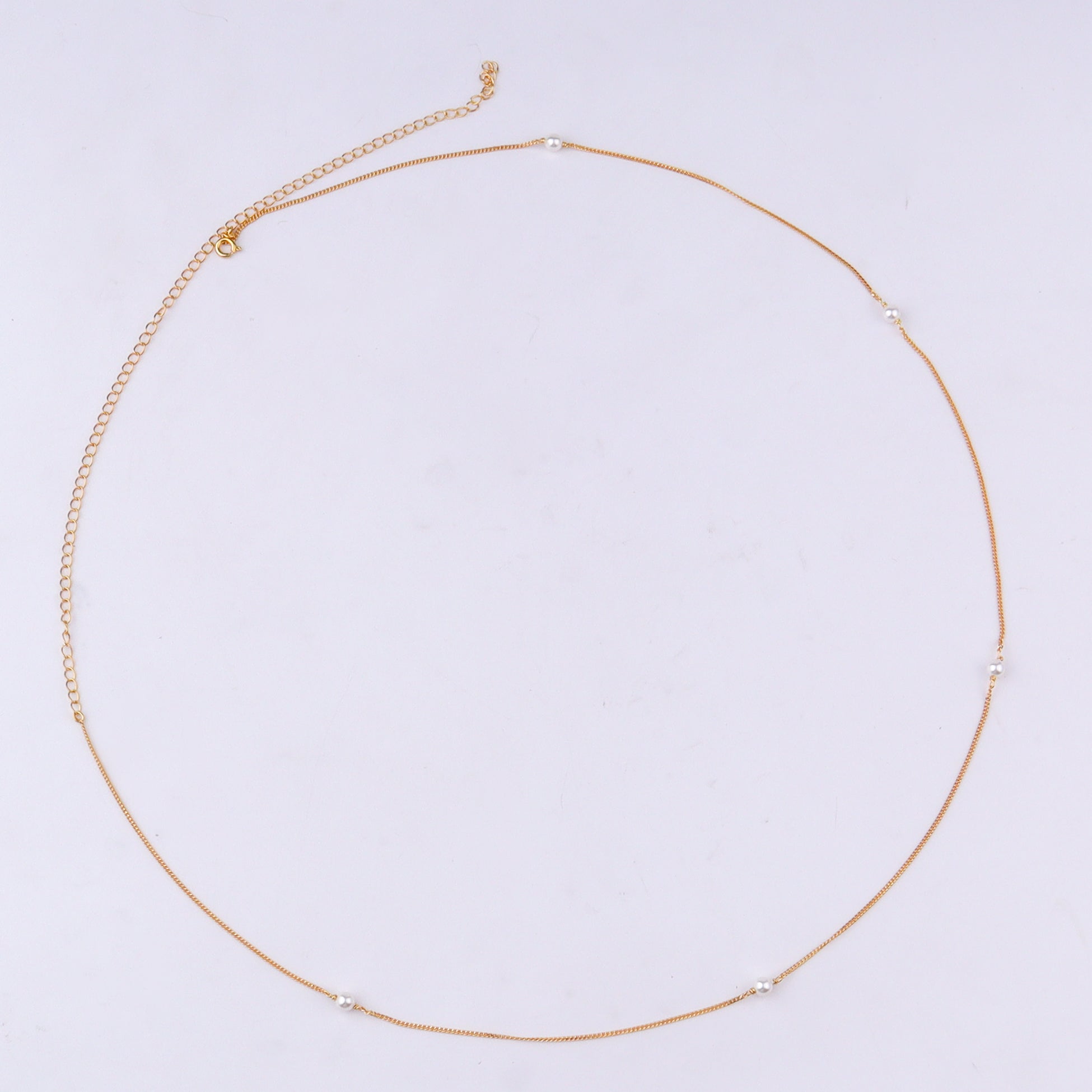 Gold chain with pearl accents