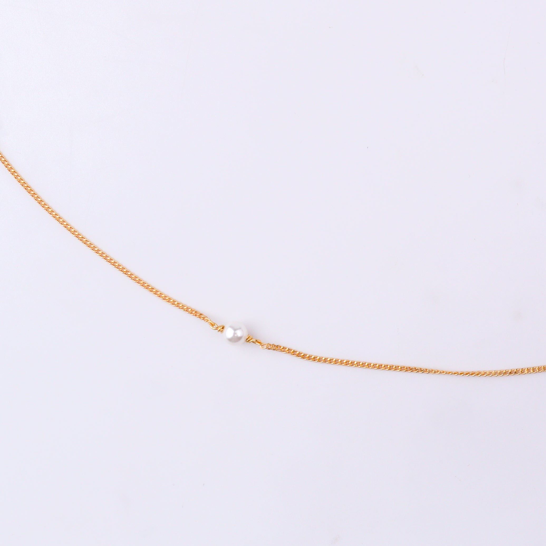 Gold chain with pearl accents