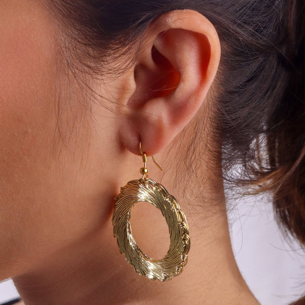 Model wearing 22K gold-plated fashion earrings for a sophisticated and contemporary jewellery look