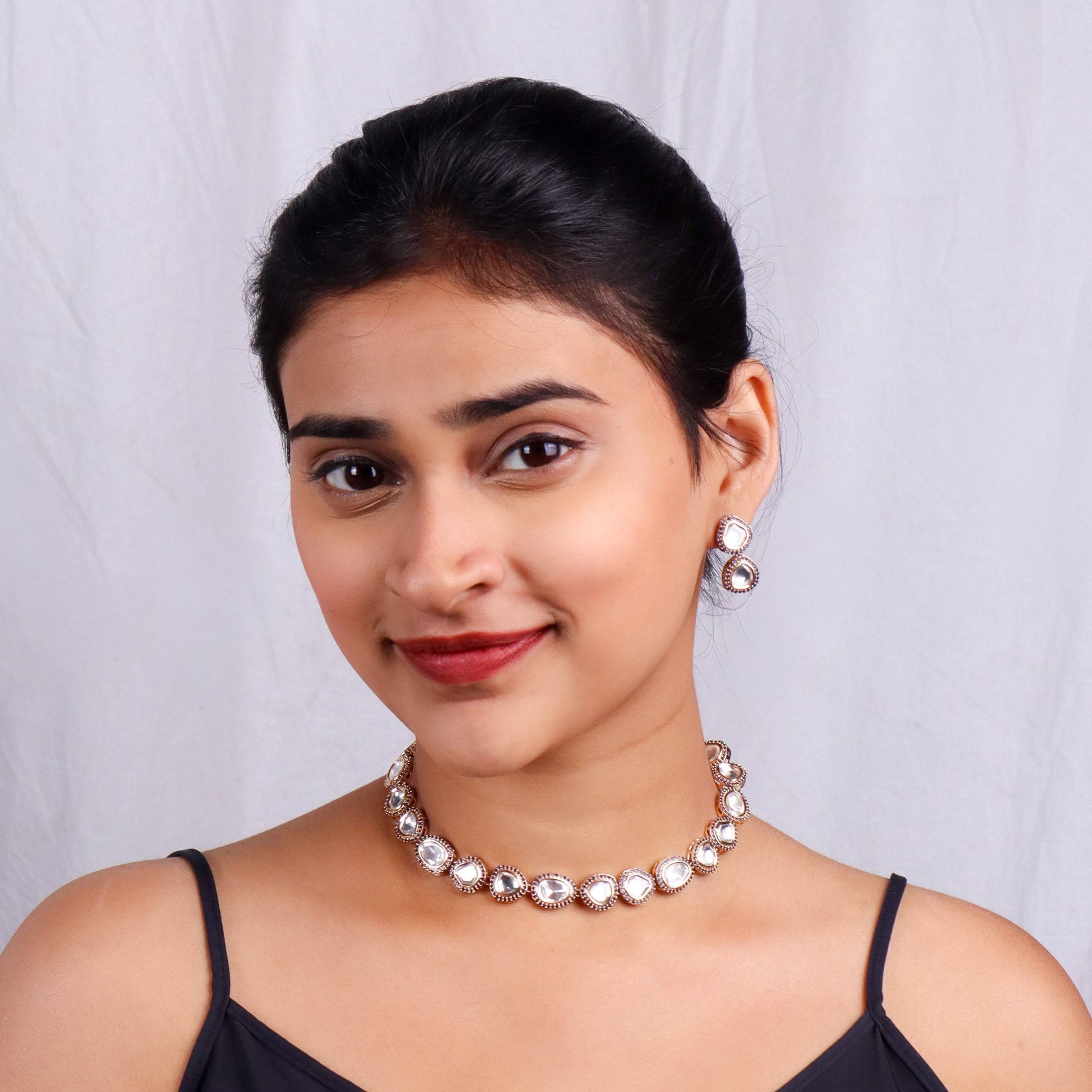 Model wearing a brass fashion set for a stylish and contemporary fashion jewellery look