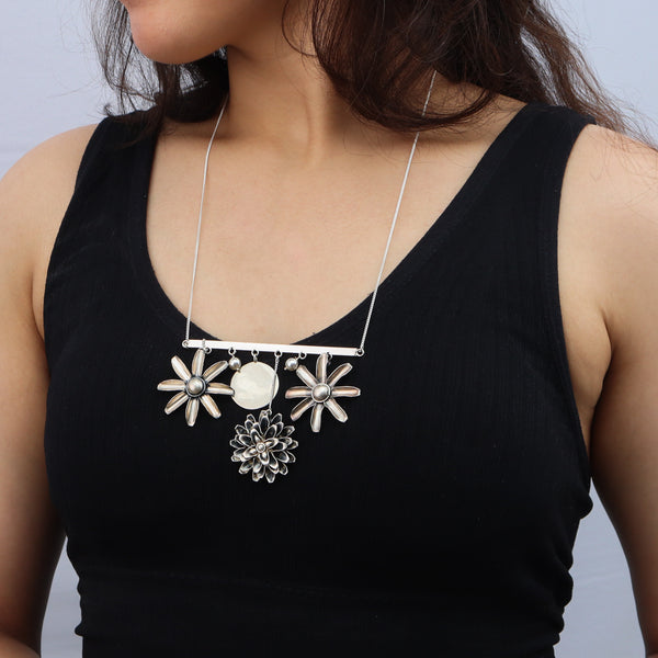 Close-up of Silver Snowflake Filigree Earring with pearl latkan