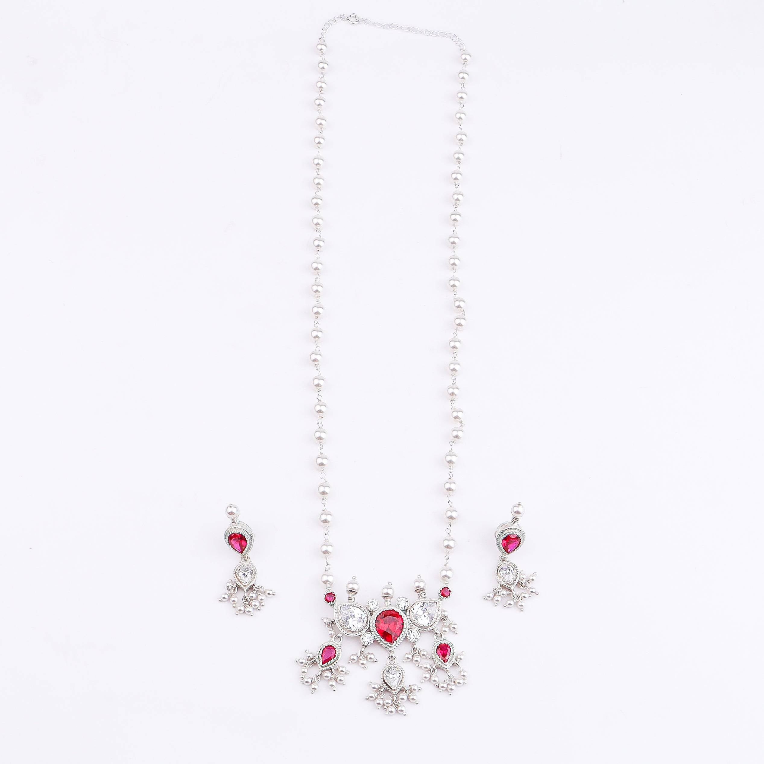 Angled view of Silver Pink & White CZ Tanmani Set with Pearl Ganthan featuring a detailed 92.5 sterling silver design