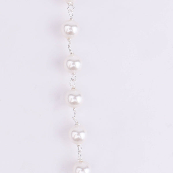 Angled view of Silver Pink & White CZ Tanmani Set with Pearl Ganthan featuring a detailed 92.5 sterling silver design