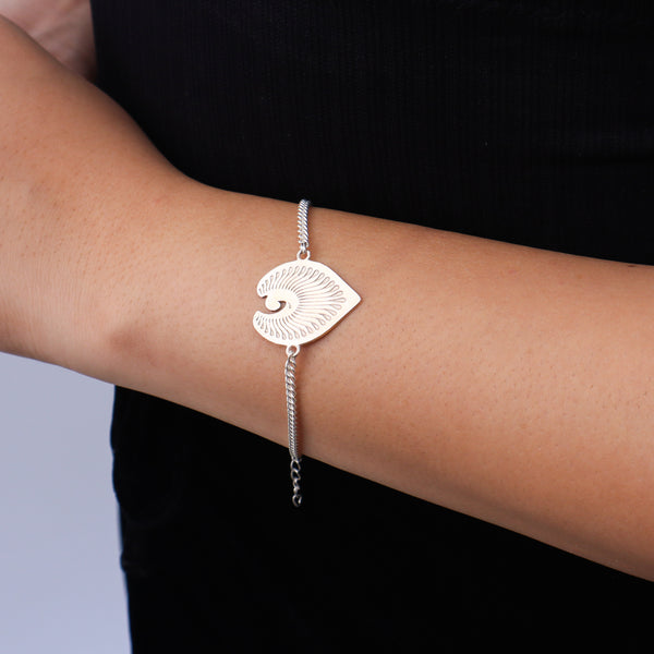 Close-up of Silver Peacock Feather Bracelet with intricate detailing
