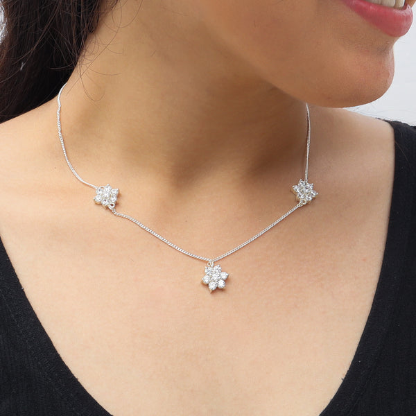 Elegant silver CZ flower necklace on model