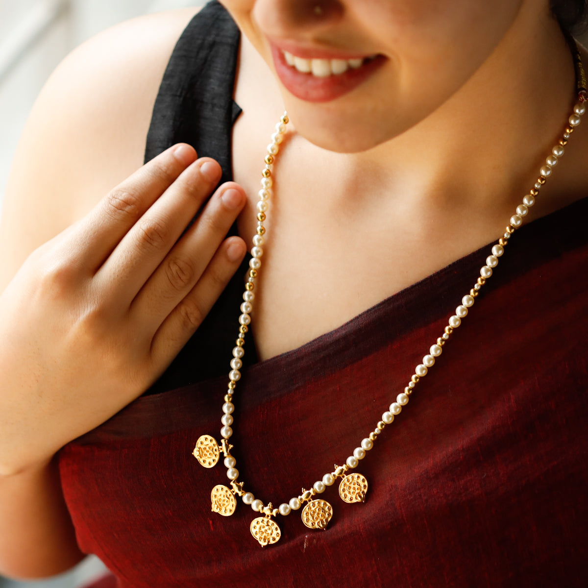 taait saaj motif detailing on gold plated silver necklace