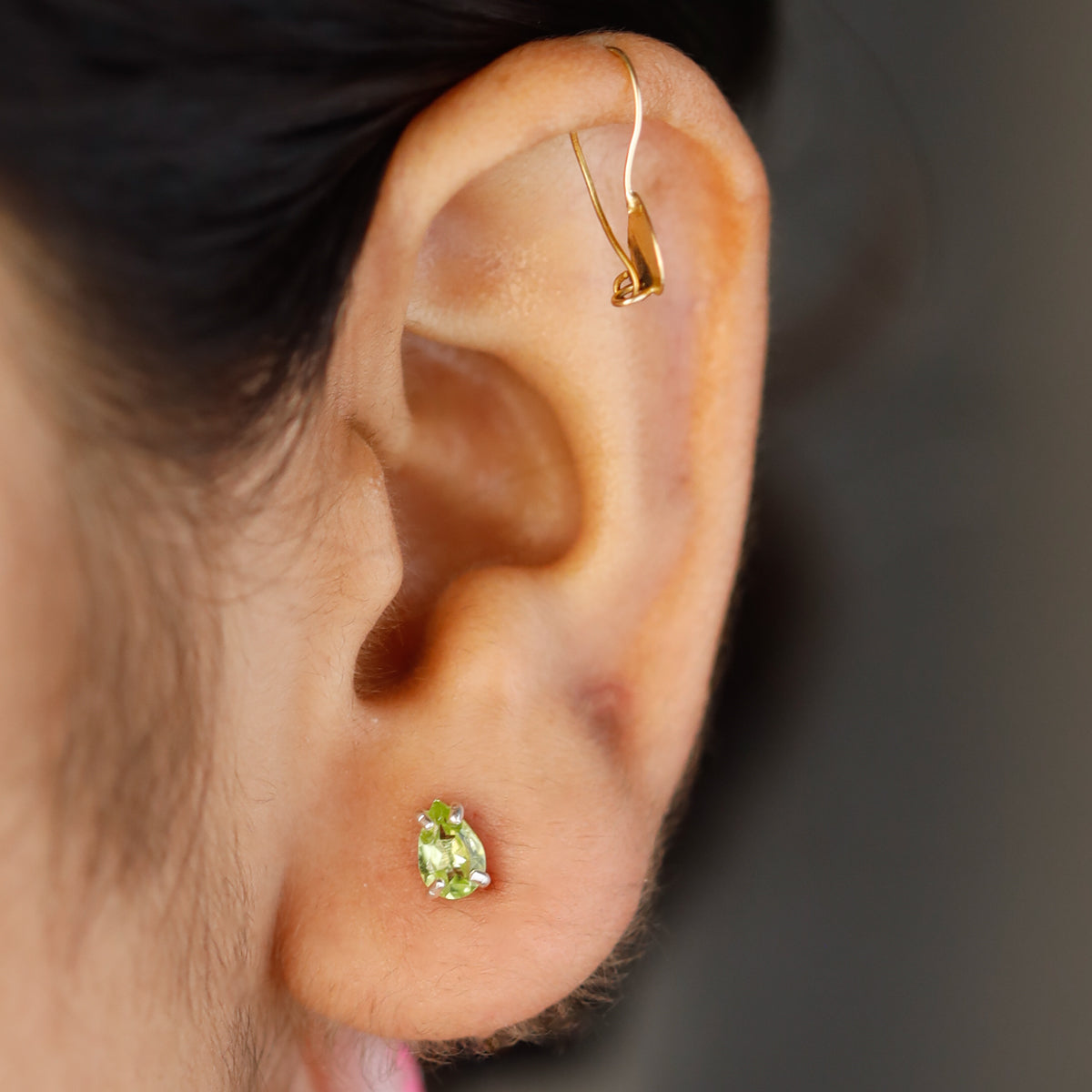 Peridot silver stud earrings close-up handcrafted detailing