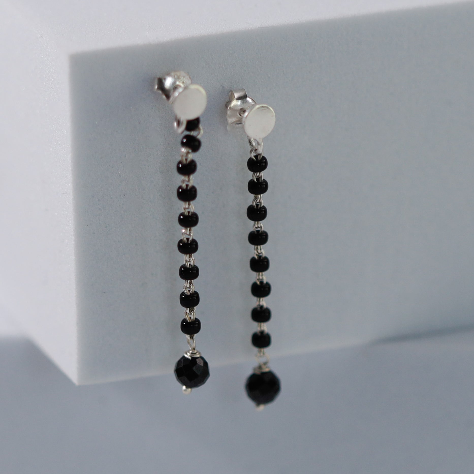 Minimal black spinel string earring design