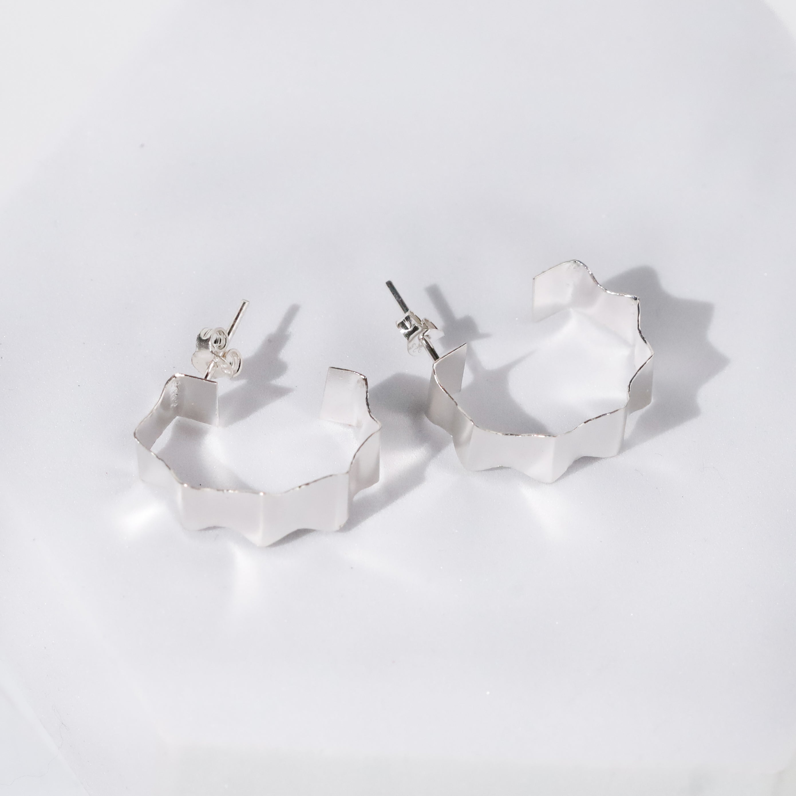 Rebecca - Fold Earrings ( Shiny Silver Finish )