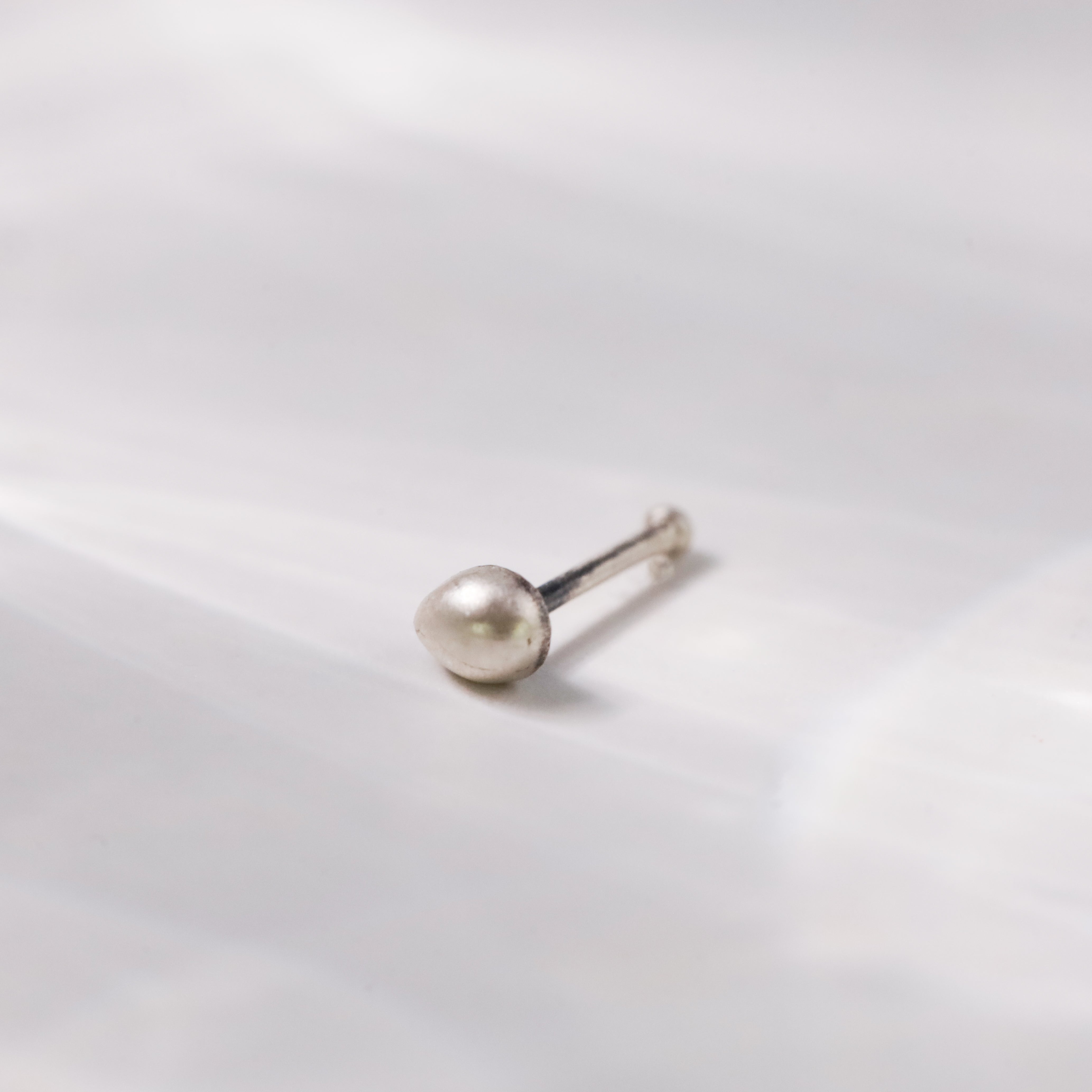 Detail shot of minimal design on Silver Tiny Nose Pin
