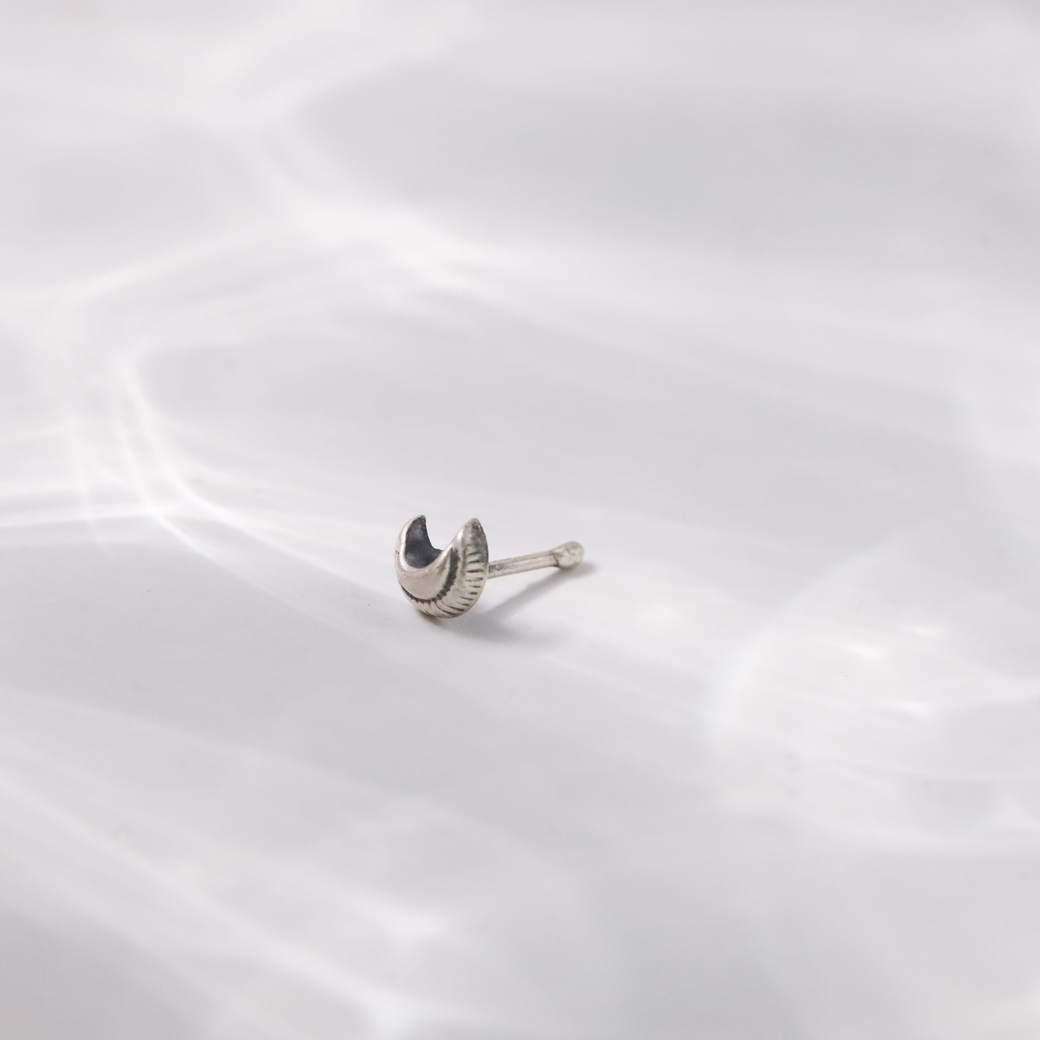 Woman styling Silver Tiny Textured Chandrakor Nose Pin ethnic look