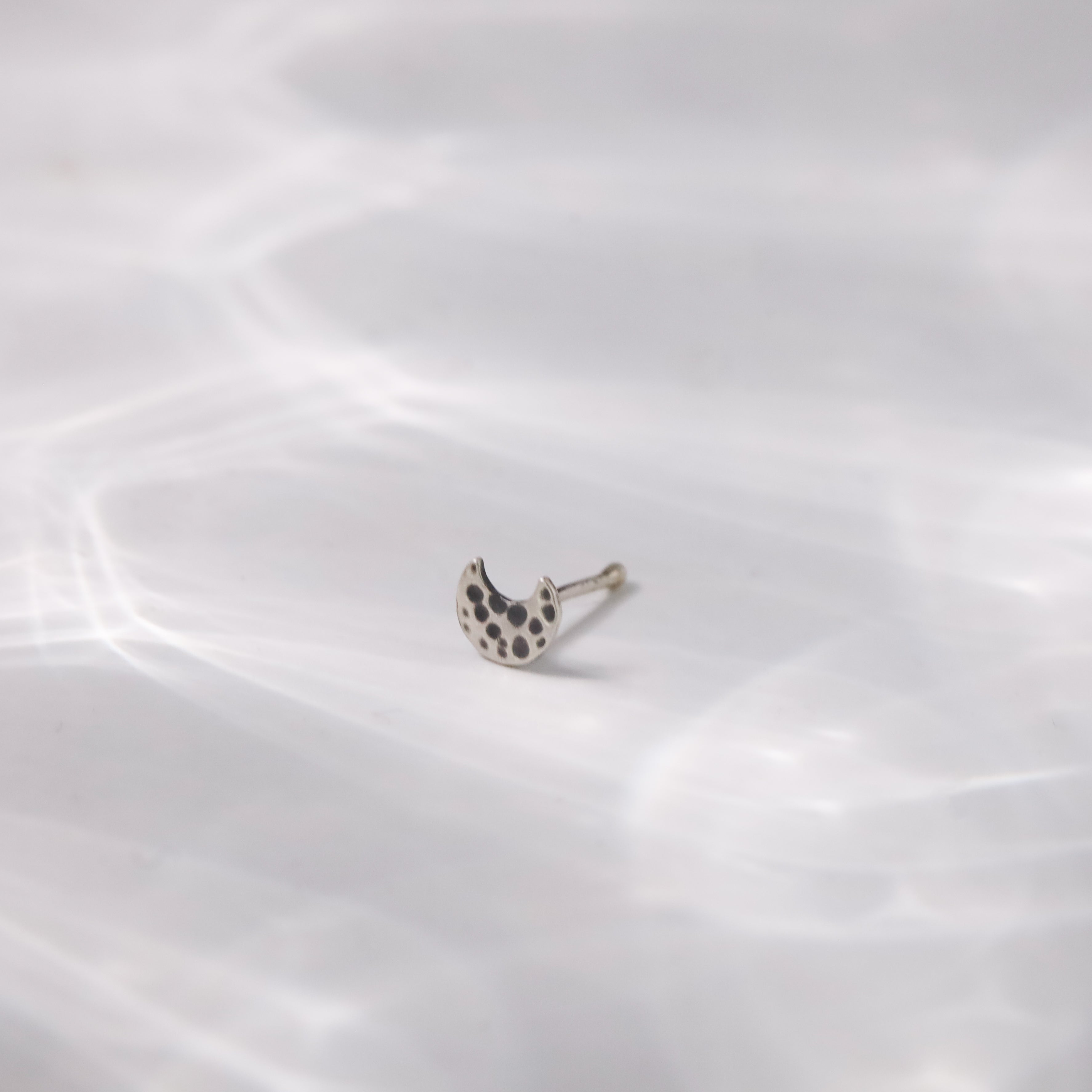 Handcrafted hammered chandrakor silver nose pin polished finish