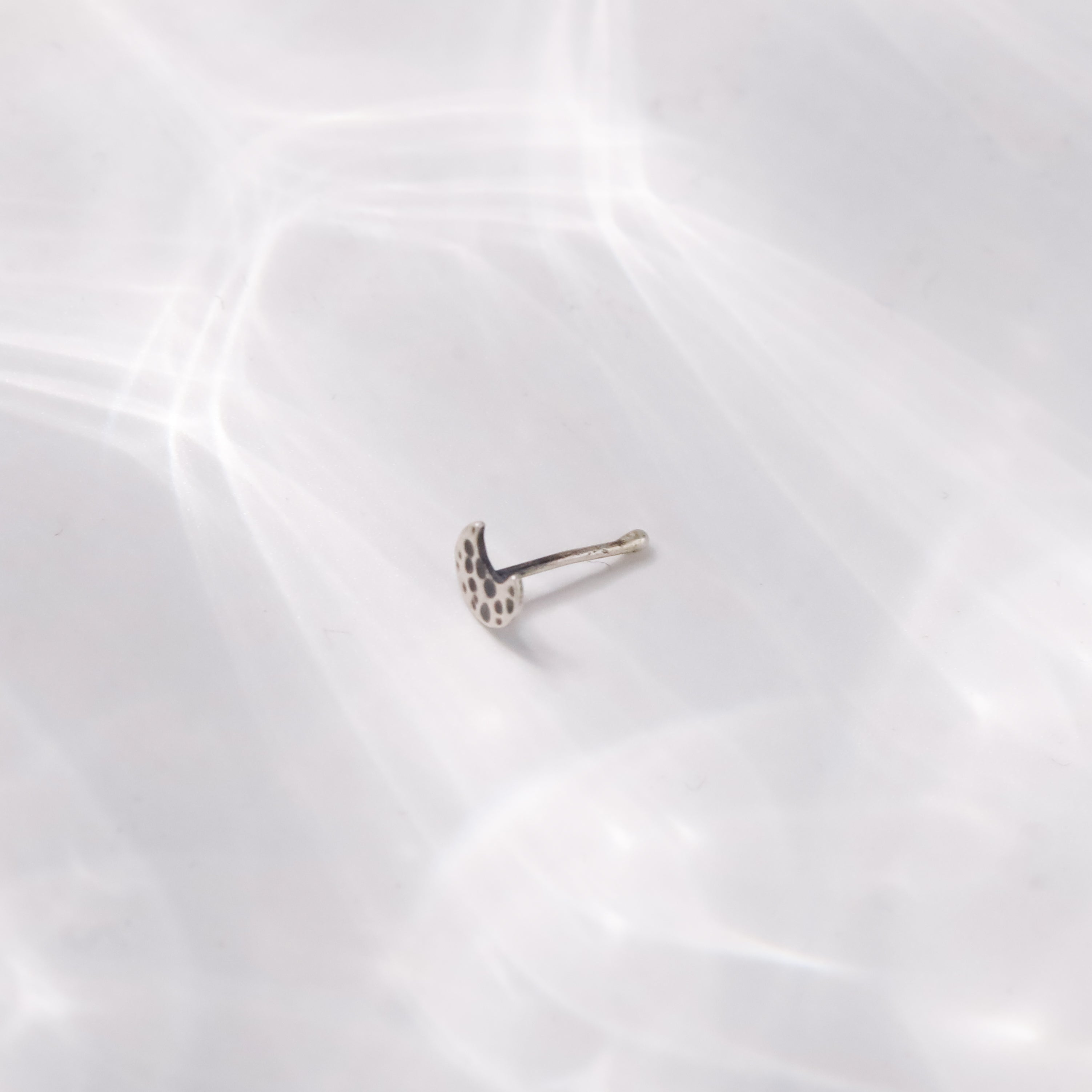 Woman styling Silver Tiny Hammered Chandrakor Nose Pin ethnic look