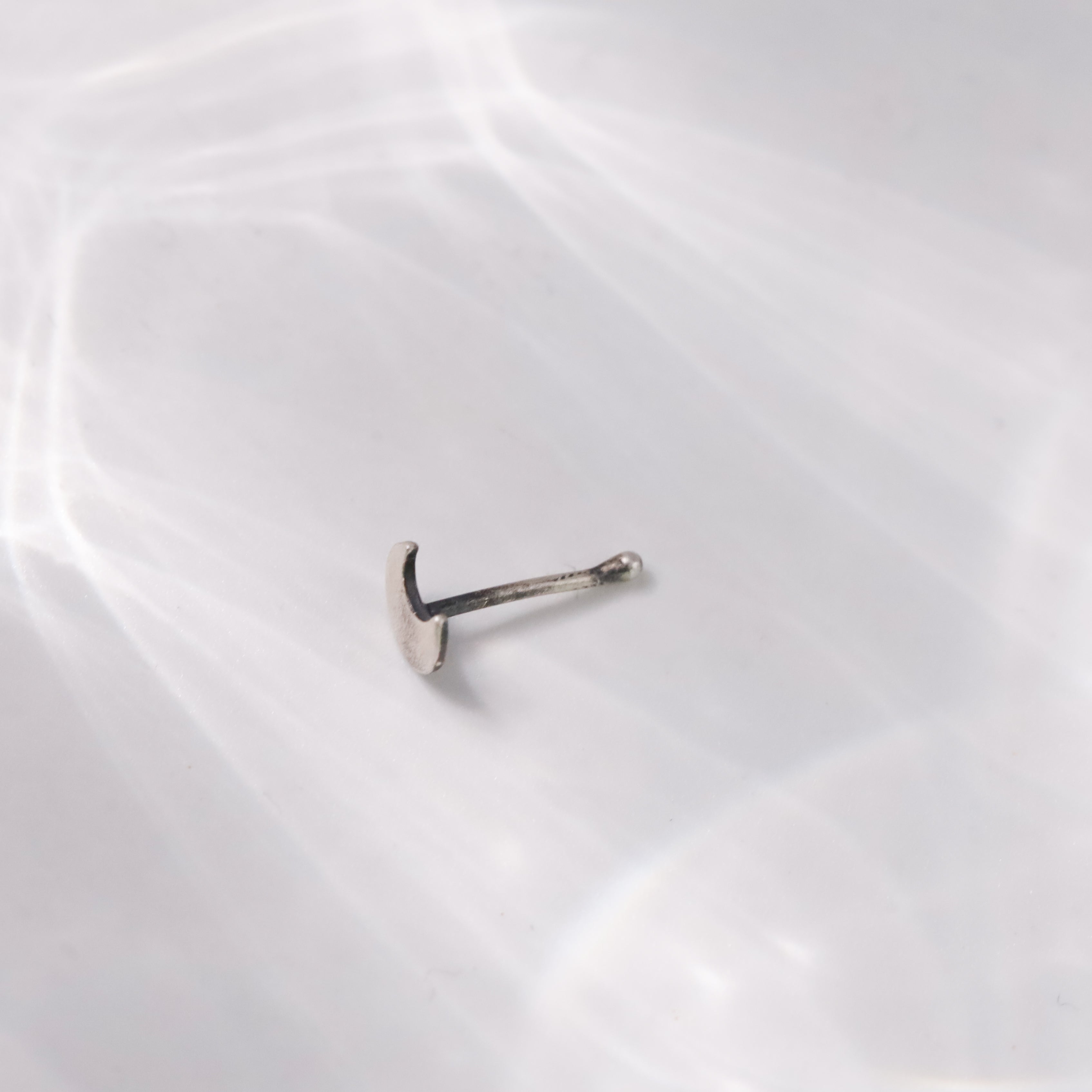 Detail shot of Chandrakor crescent motif in sterling silver