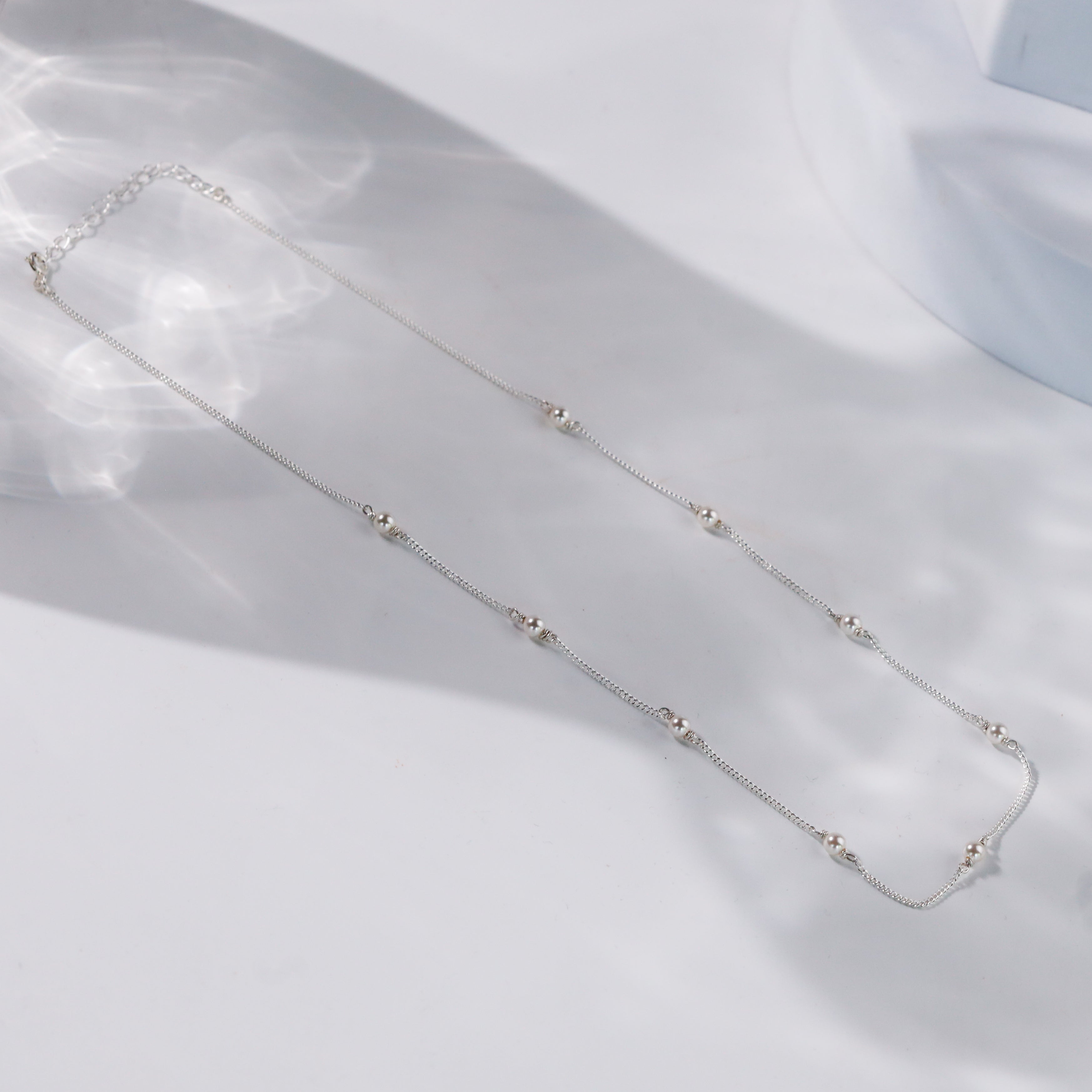 style white pearl chain with modern attire