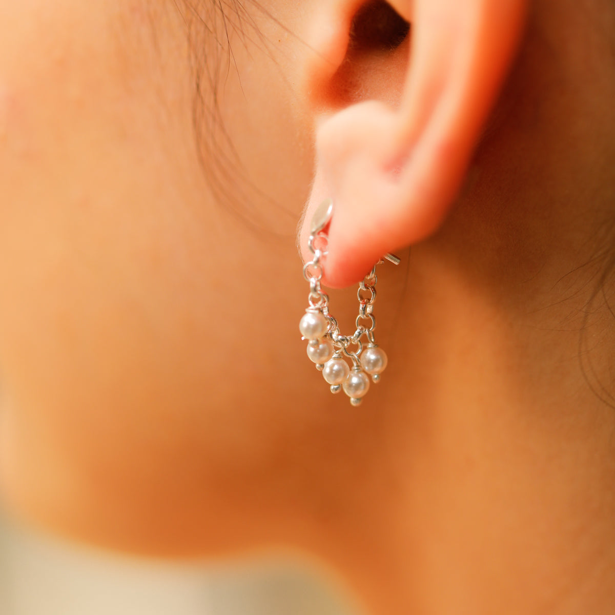 Small pearl earrings with delicate craftsmanship