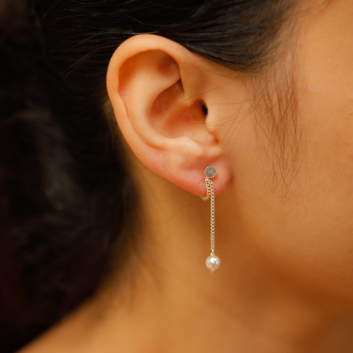 Pearl Trinket Dangler earrings on ear