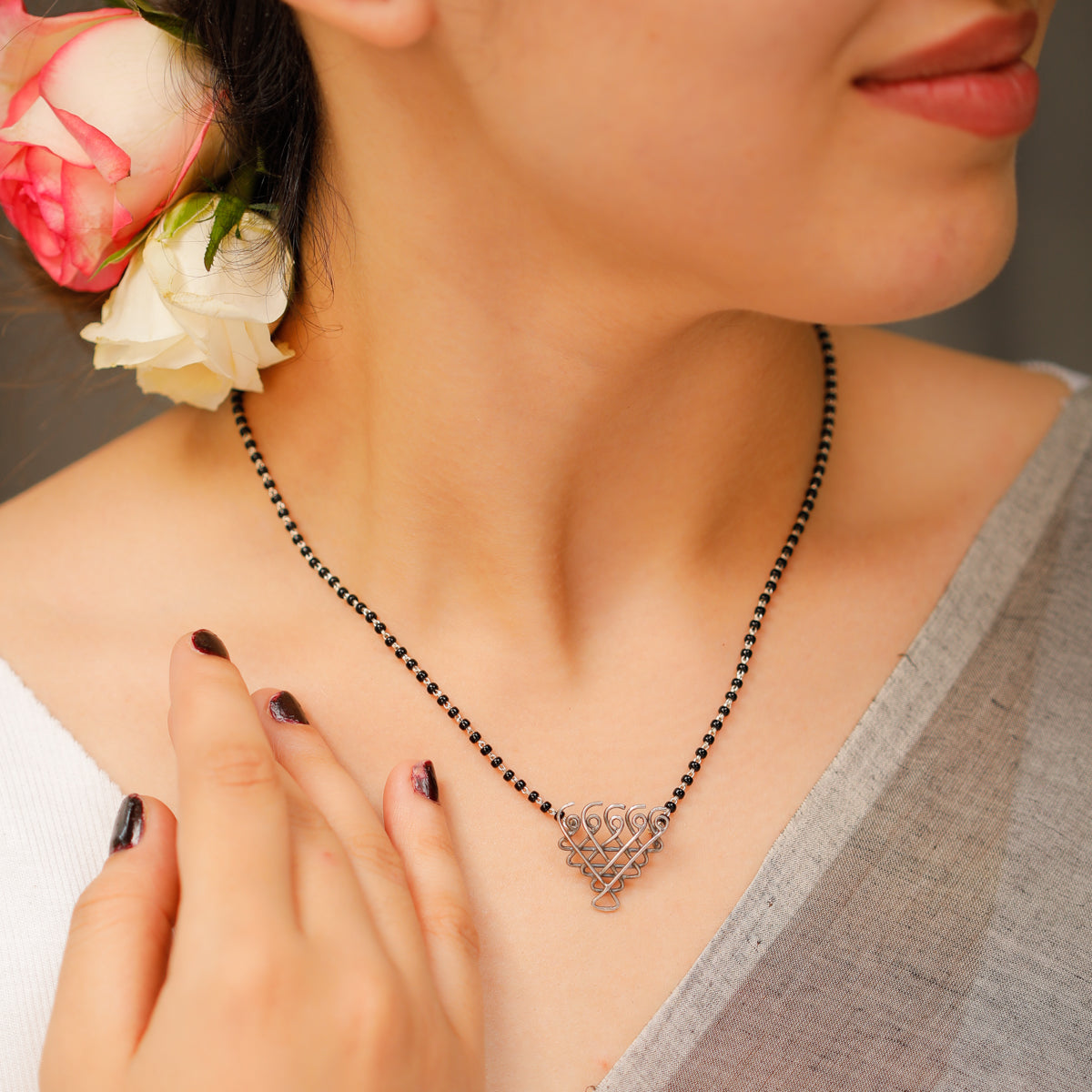 Small Saraswati motif silver mangalsutra detailing