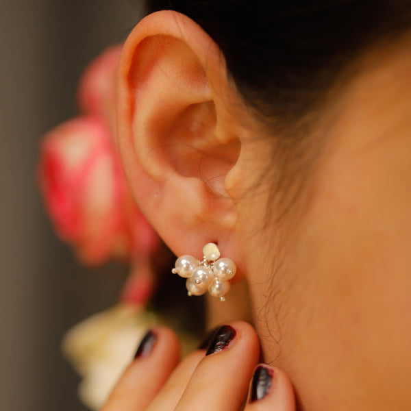 Pearl nunch studs earrings on ear