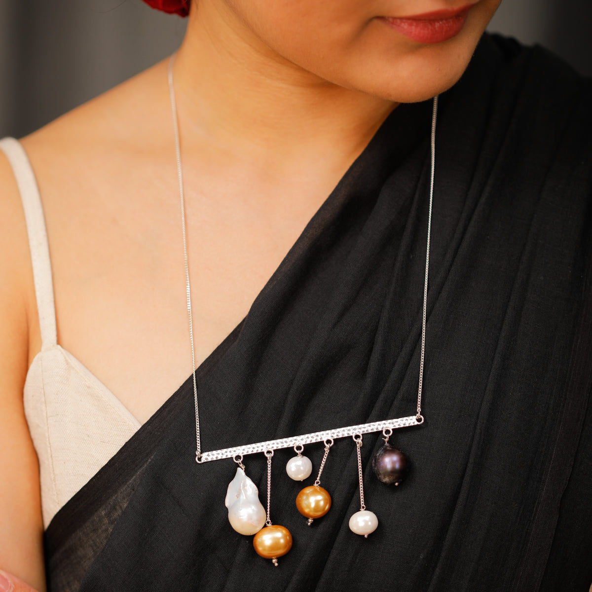 Modern abstract pearl silver necklace detailing
