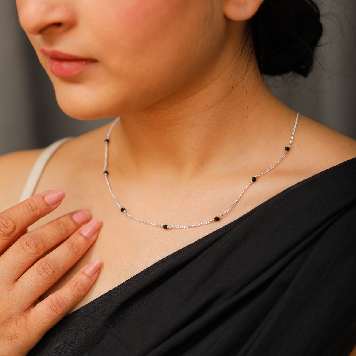 Silver necklace with black spinel stones