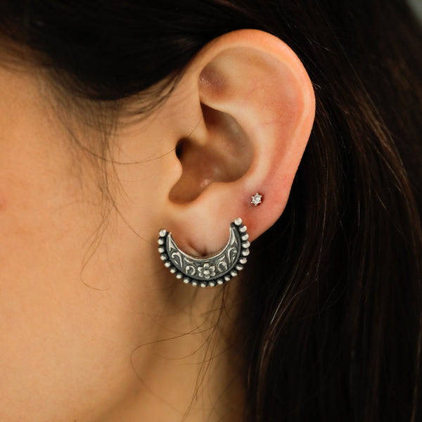 Silver Chandrakor Earrings with intricate floral design and beaded border