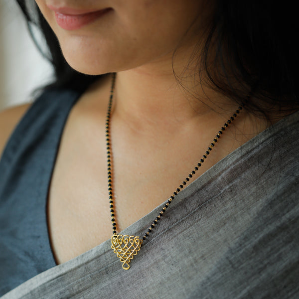 Black and gold Saraswati Mangalsutra with intricate pendant