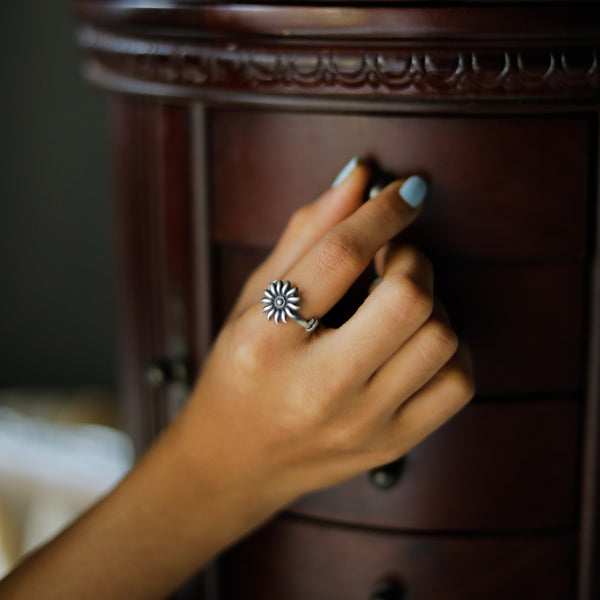 Silver Sun ring on finger