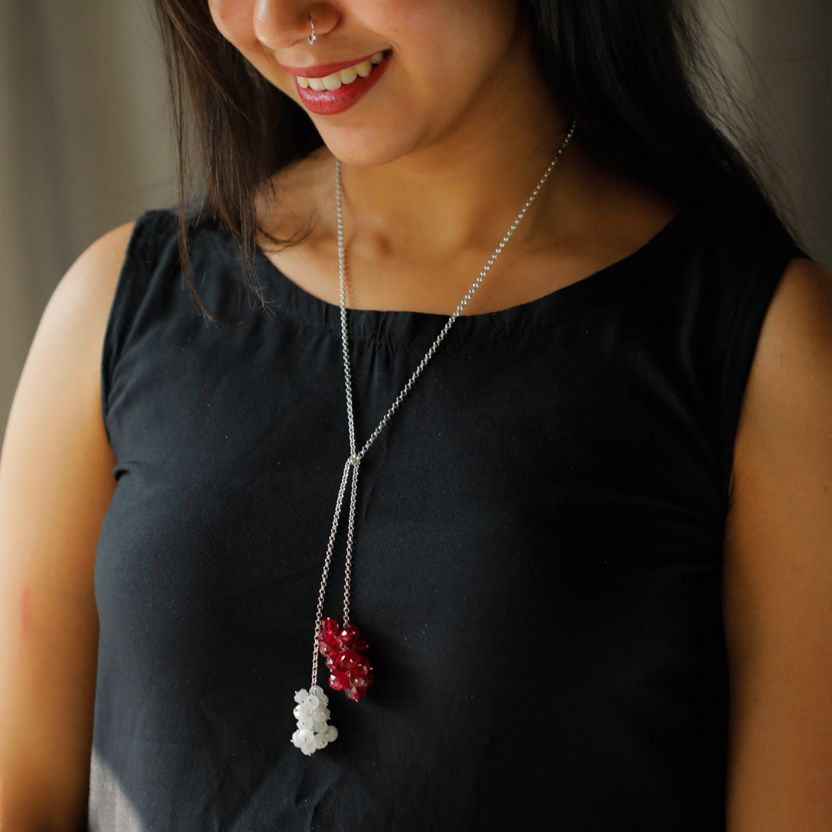 ruby stone cluster on silver tie and wear necklace