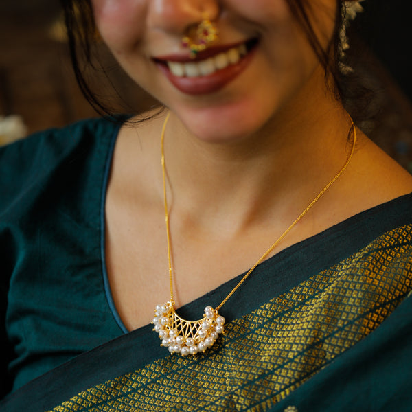 Gold plated pearl necklace with intricate design