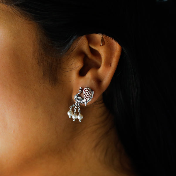 Silver peacock earrings with pearls for traditional jewelry