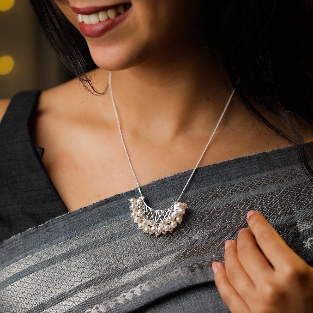 Model wearing silver chand filigree pearl necklace festive look