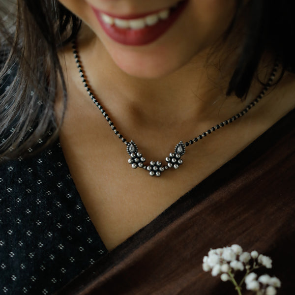 Silver Kudi Nath Mangalsutra with black beads and floral motifs