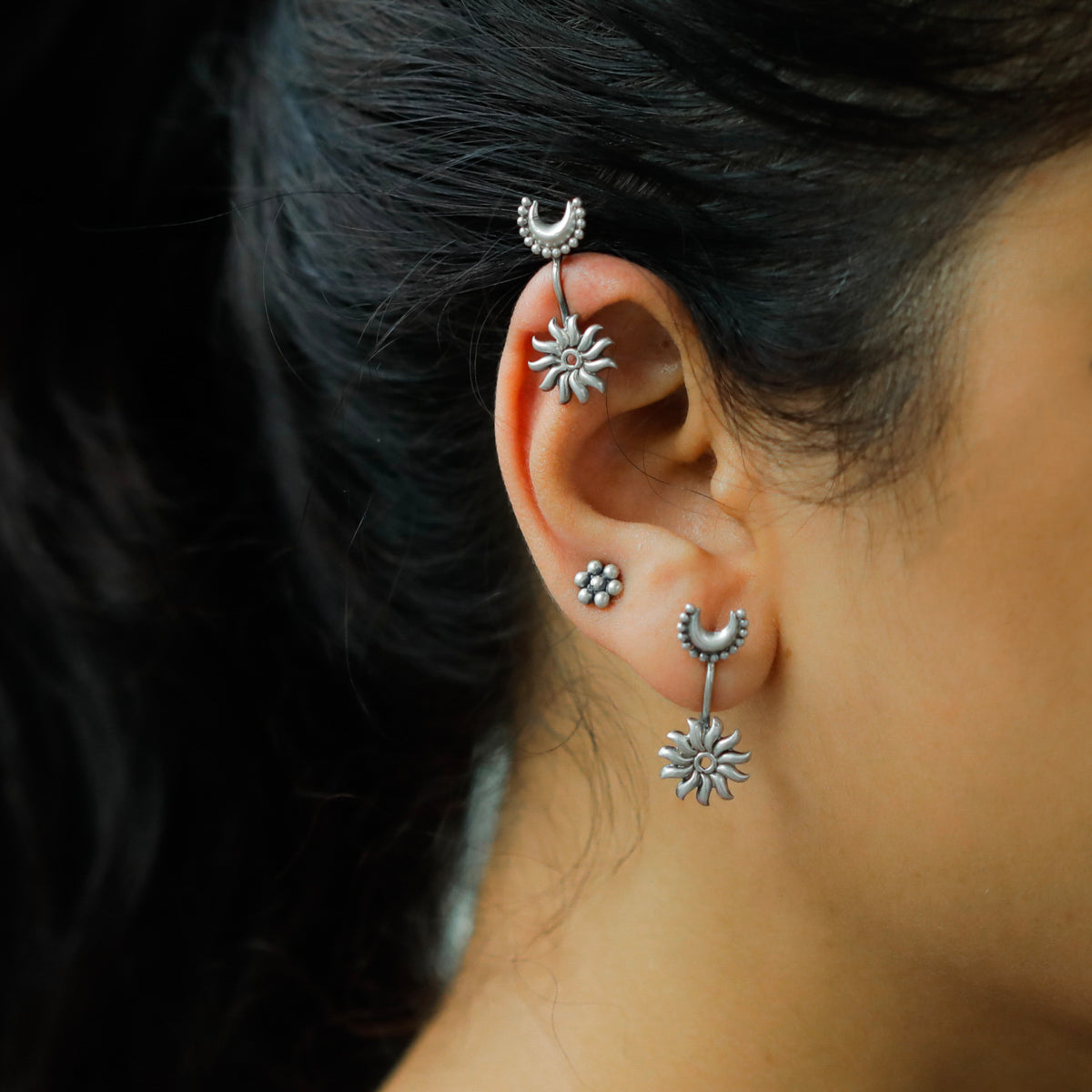 Silver clip-on earrings with sun and moon motifs for traditional wear