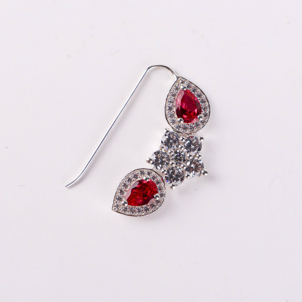 Close-up of silver flower pink drop nath with cz stones pierced small