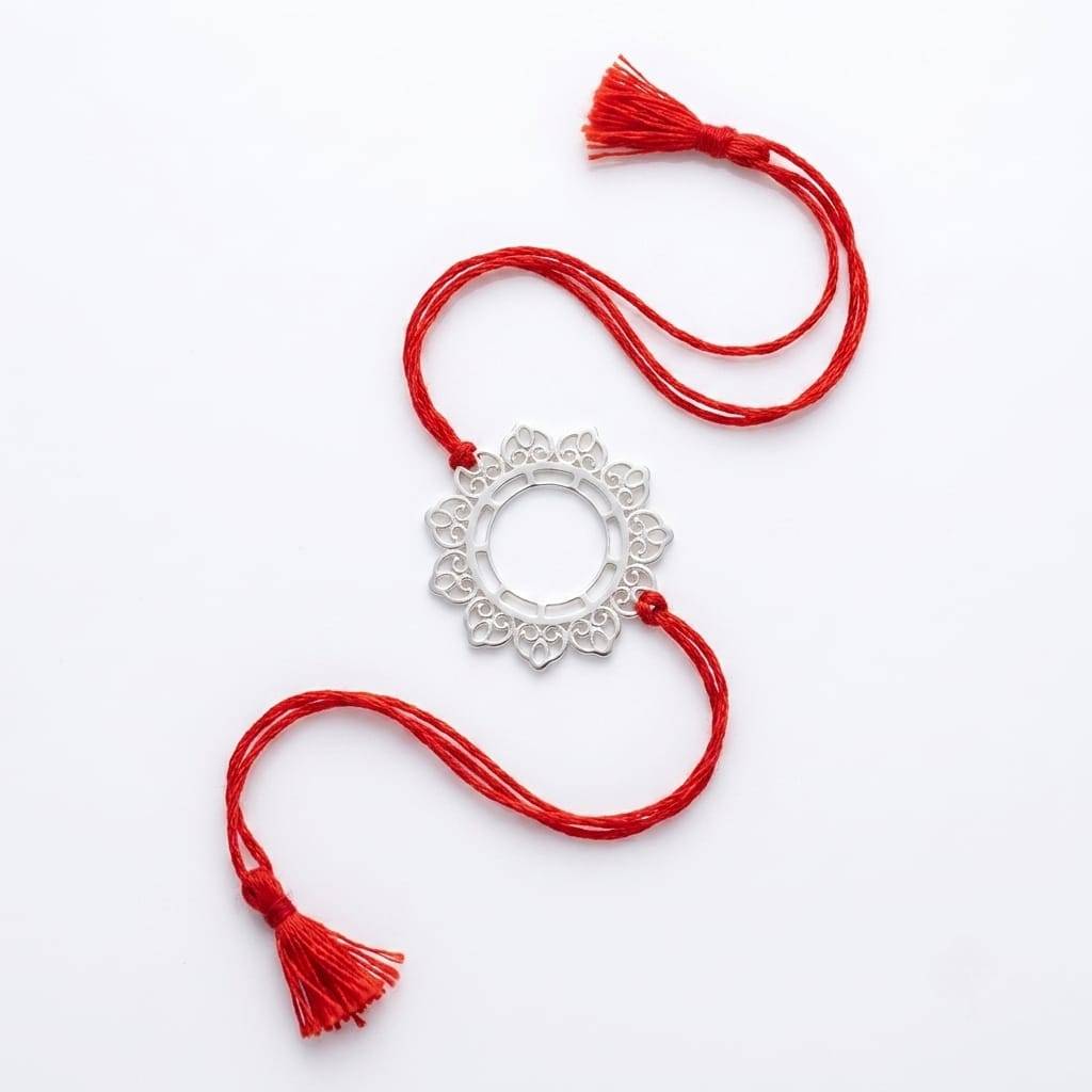 Angled view of Big Filigree Silver Rakhi in 92.5 sterling silver with elegant handcrafted design