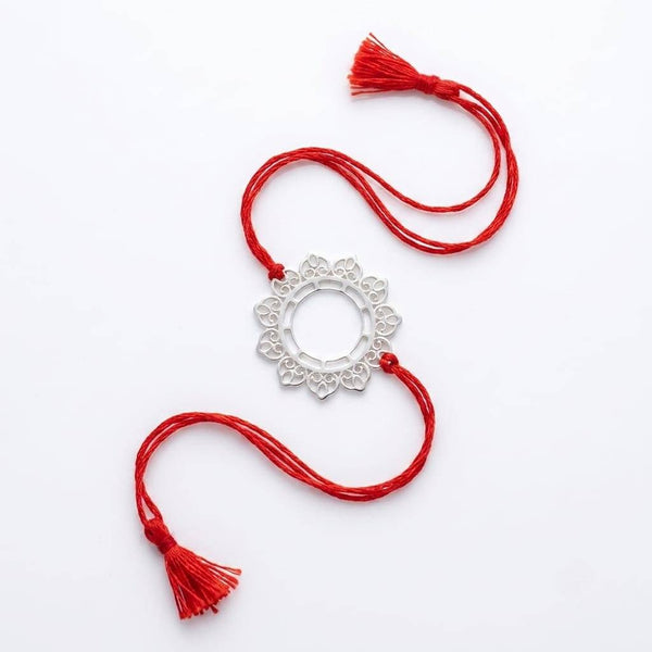 Angled view of Big Filigree Silver Rakhi in 92.5 sterling silver with elegant handcrafted design
