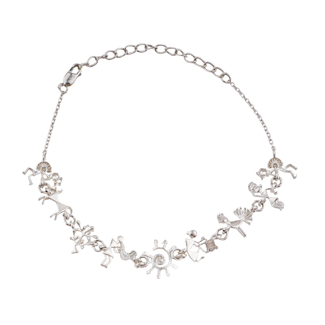 Silver bracelet with Warli motifs, tribal art jewelry, intricate silver design