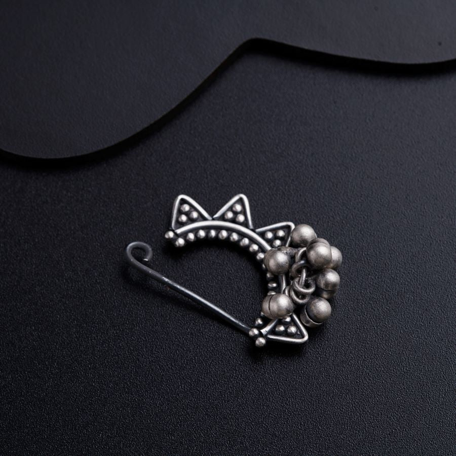 a brooch with a cat design on it